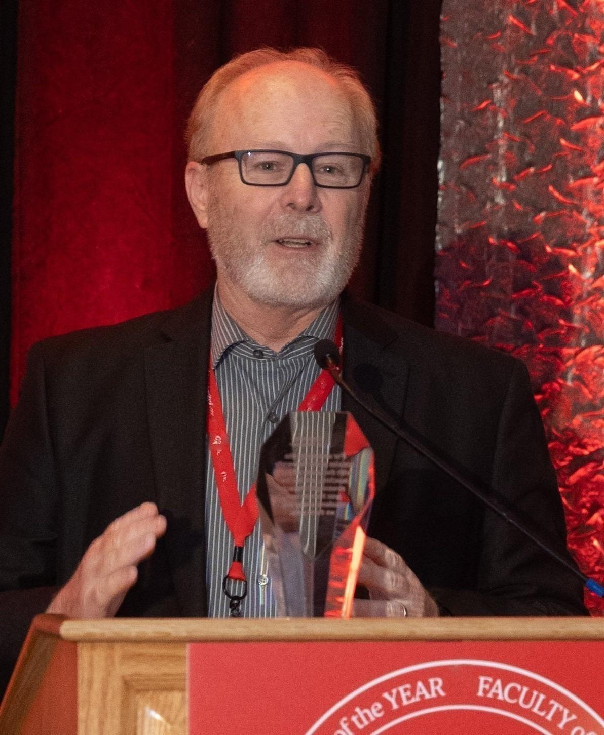 Brent Duncan accepts the Faculty of the Year Award